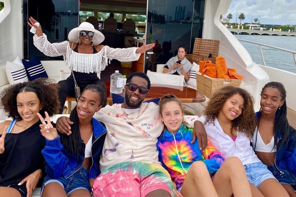 Sean Diddy Combs is on double daddy duty as he hops 